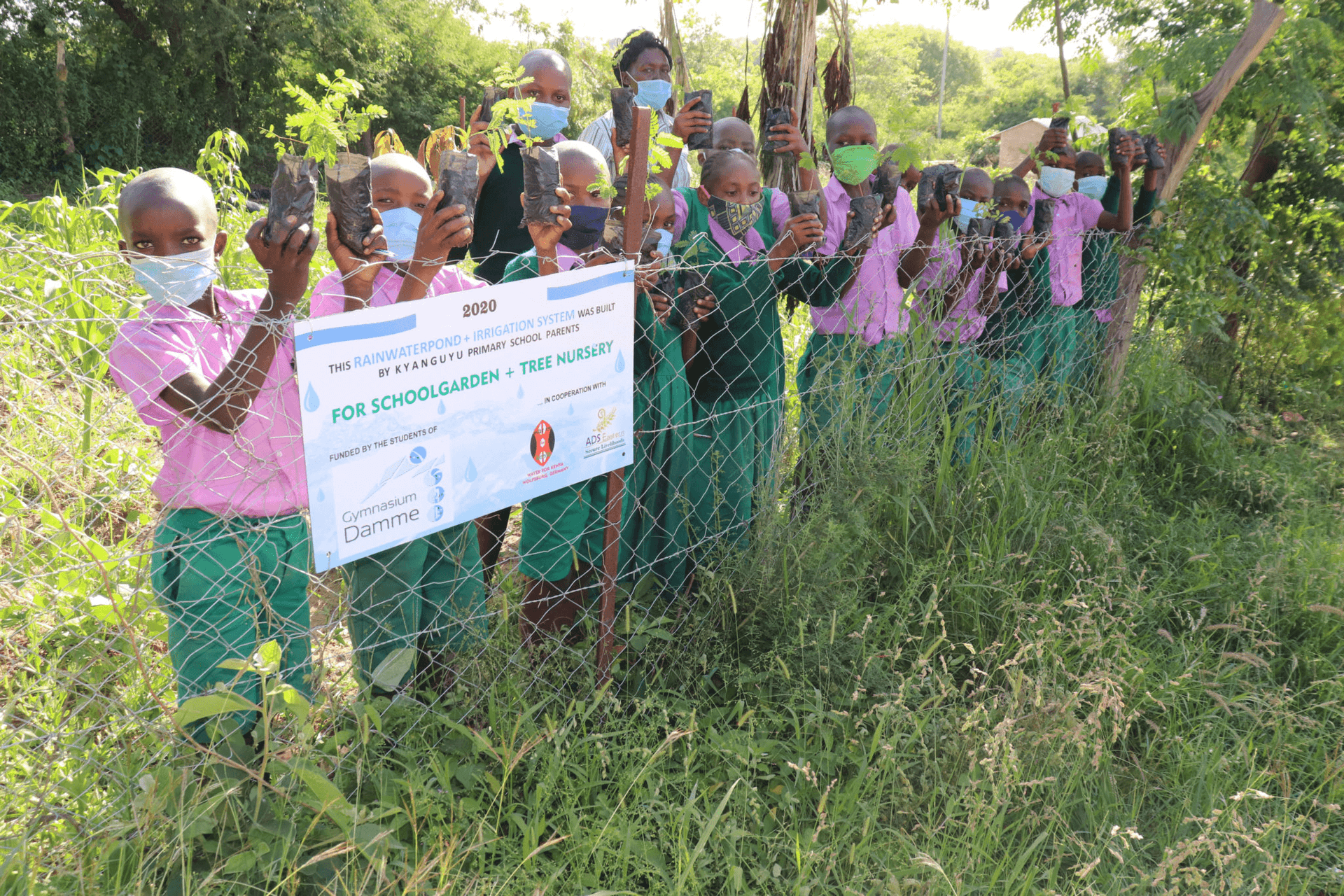 Students planting trees at Kyanguyu Primary School
